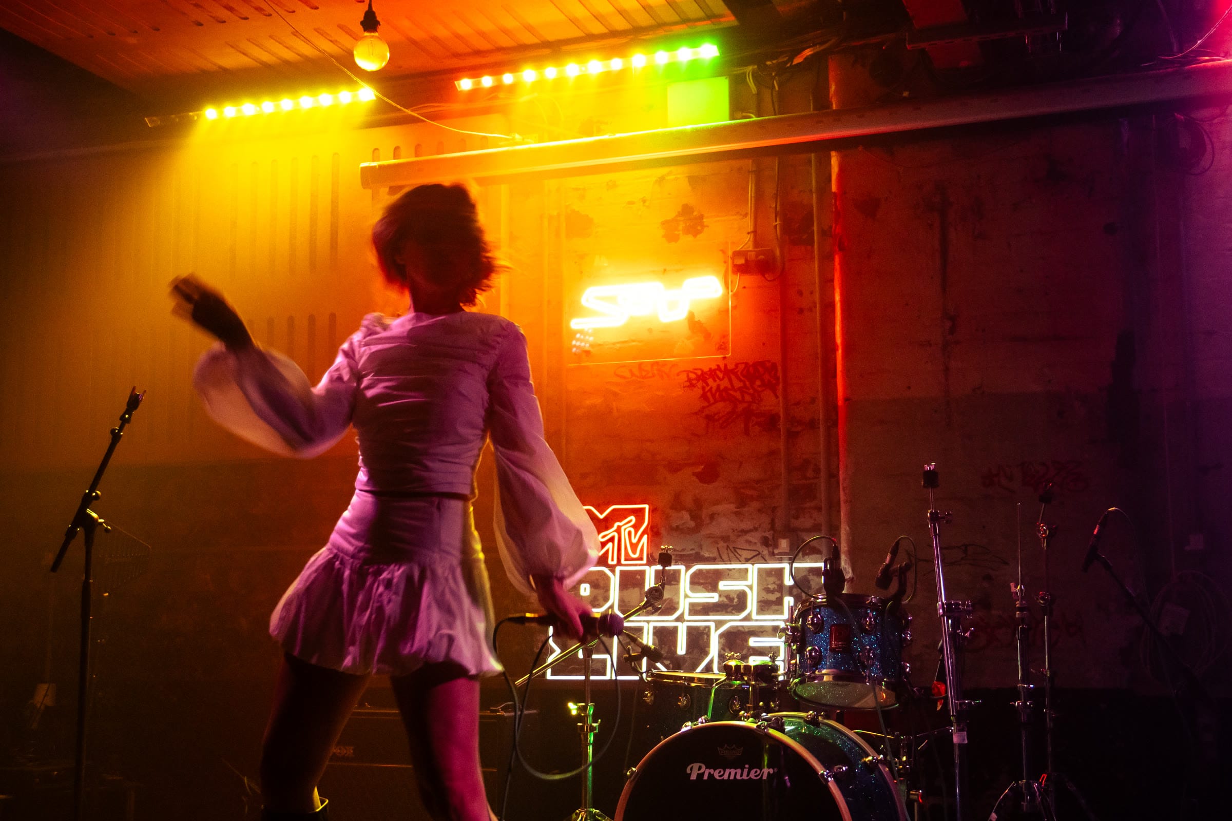 An emerging artist performing at a grassroots venue