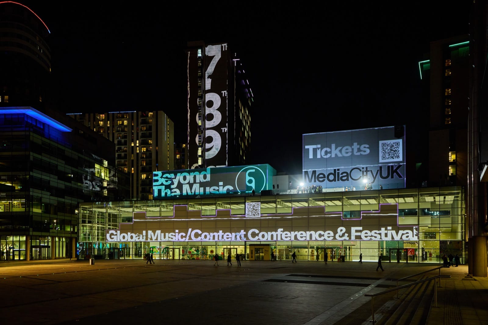 MediaCity, Salford at night with Beyond The Music projections